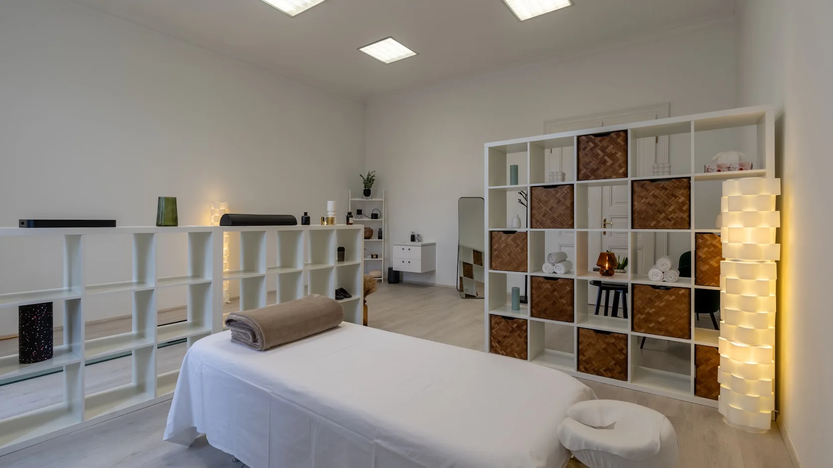 Calm acupuncture treatment room prepared for an evening sleep-support session
